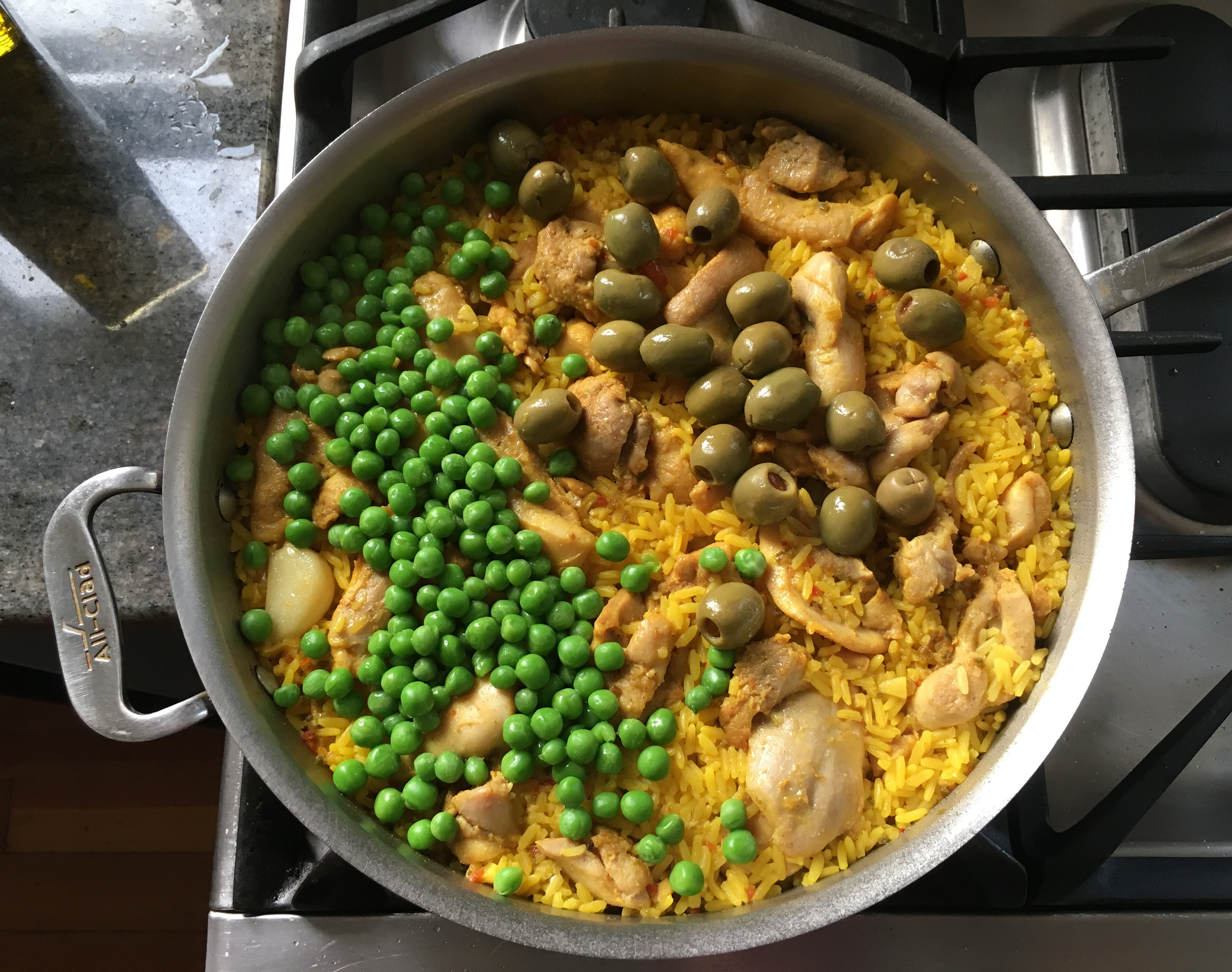 Brazilian style chicken & rice with olives & peas.