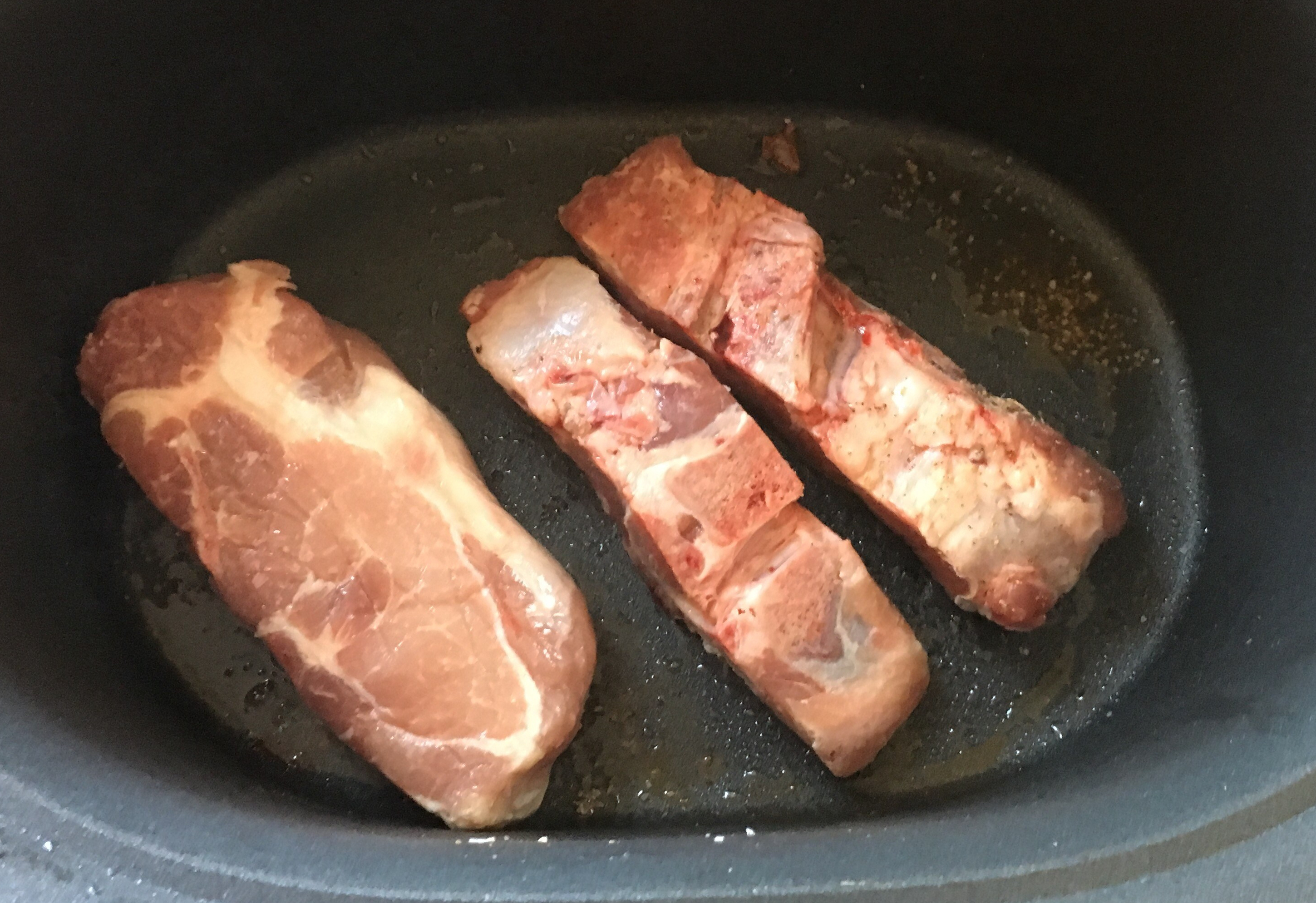 Country style ribs being browned.