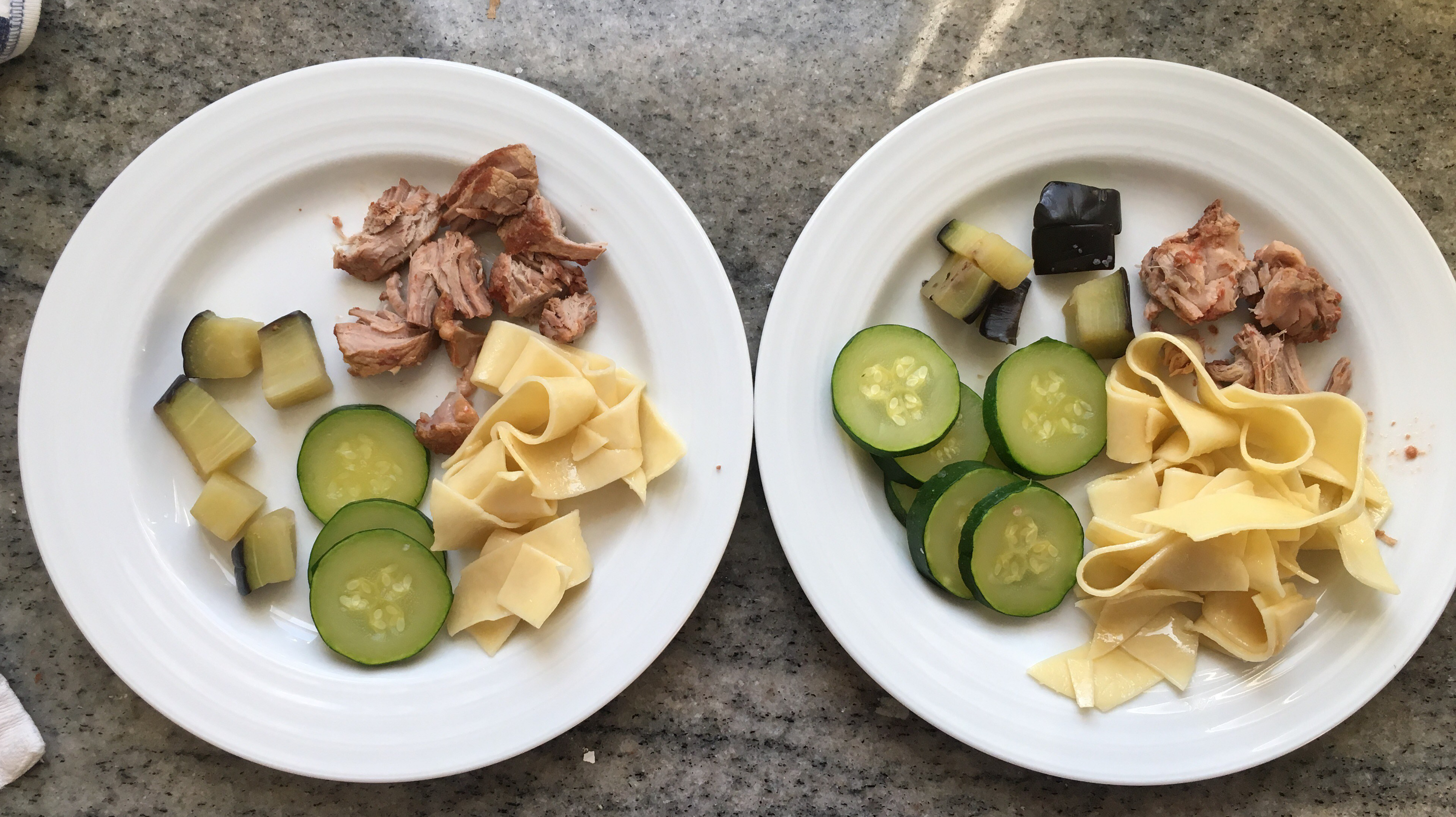 Picture of kids plates with the steamed zucchini and eggplant.