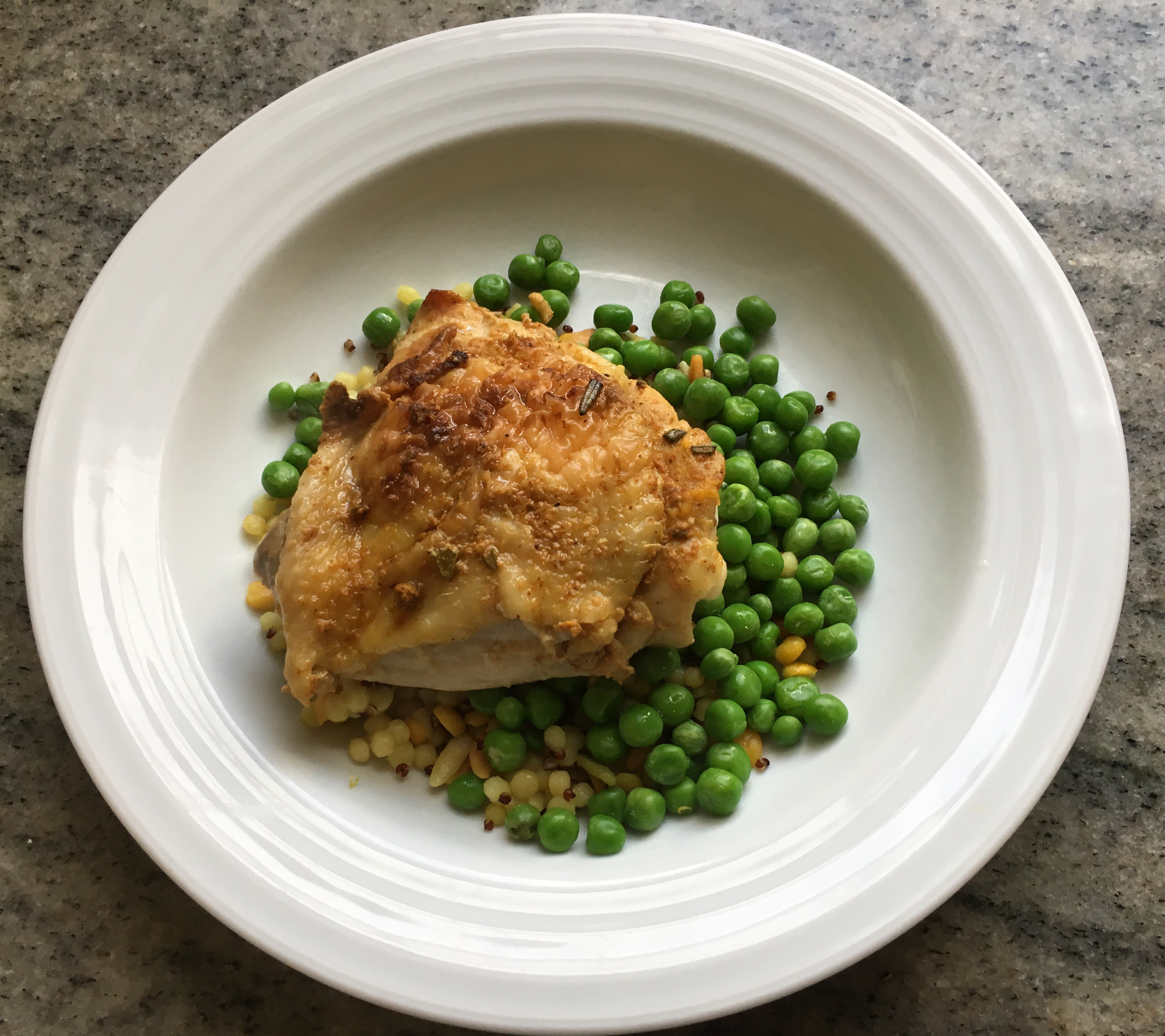 Leftover bbq chicken over cous cous with peas