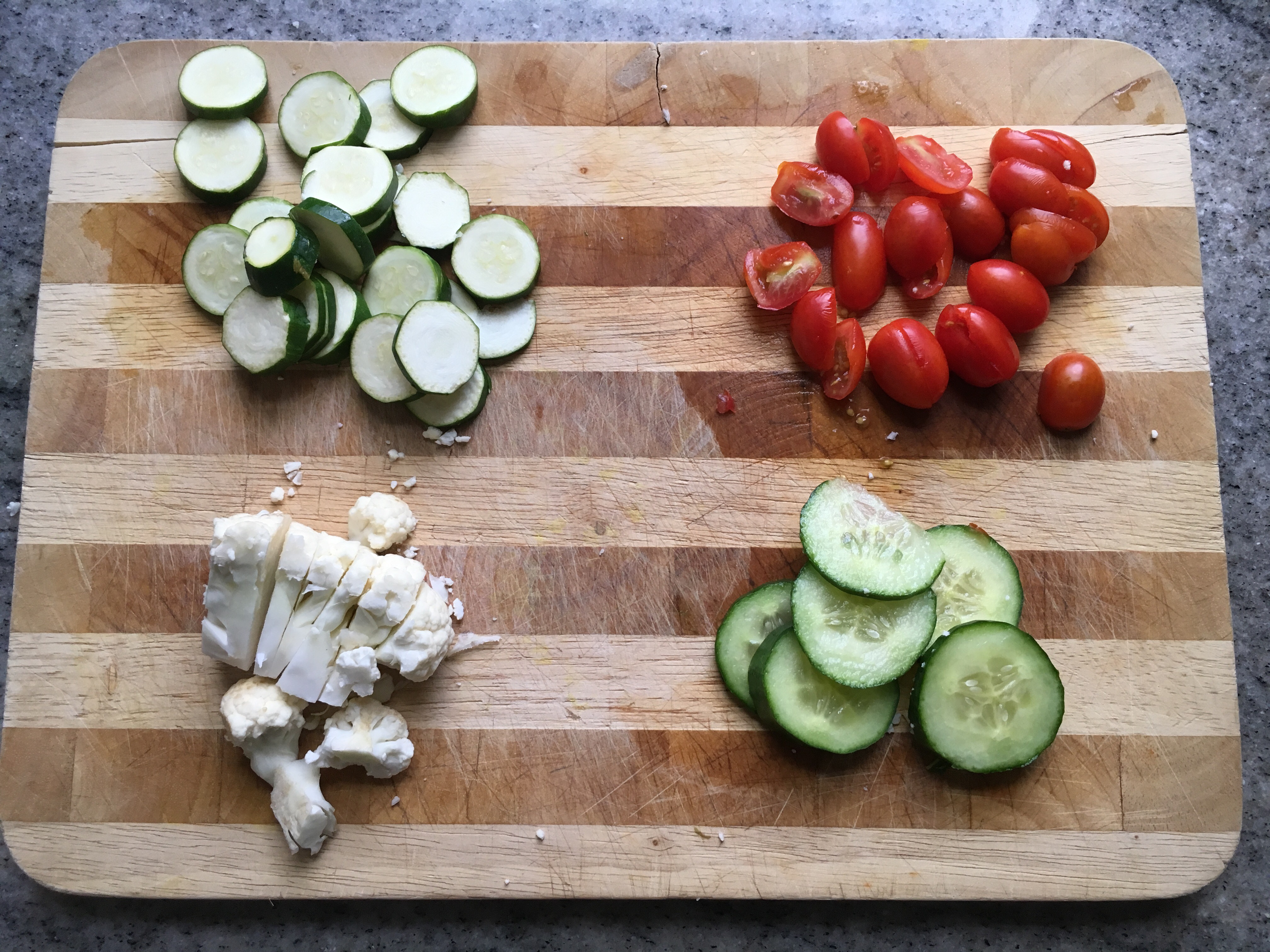 Chopped zucchini for steaming, grape tomatoes, cauliflower & cucumbers