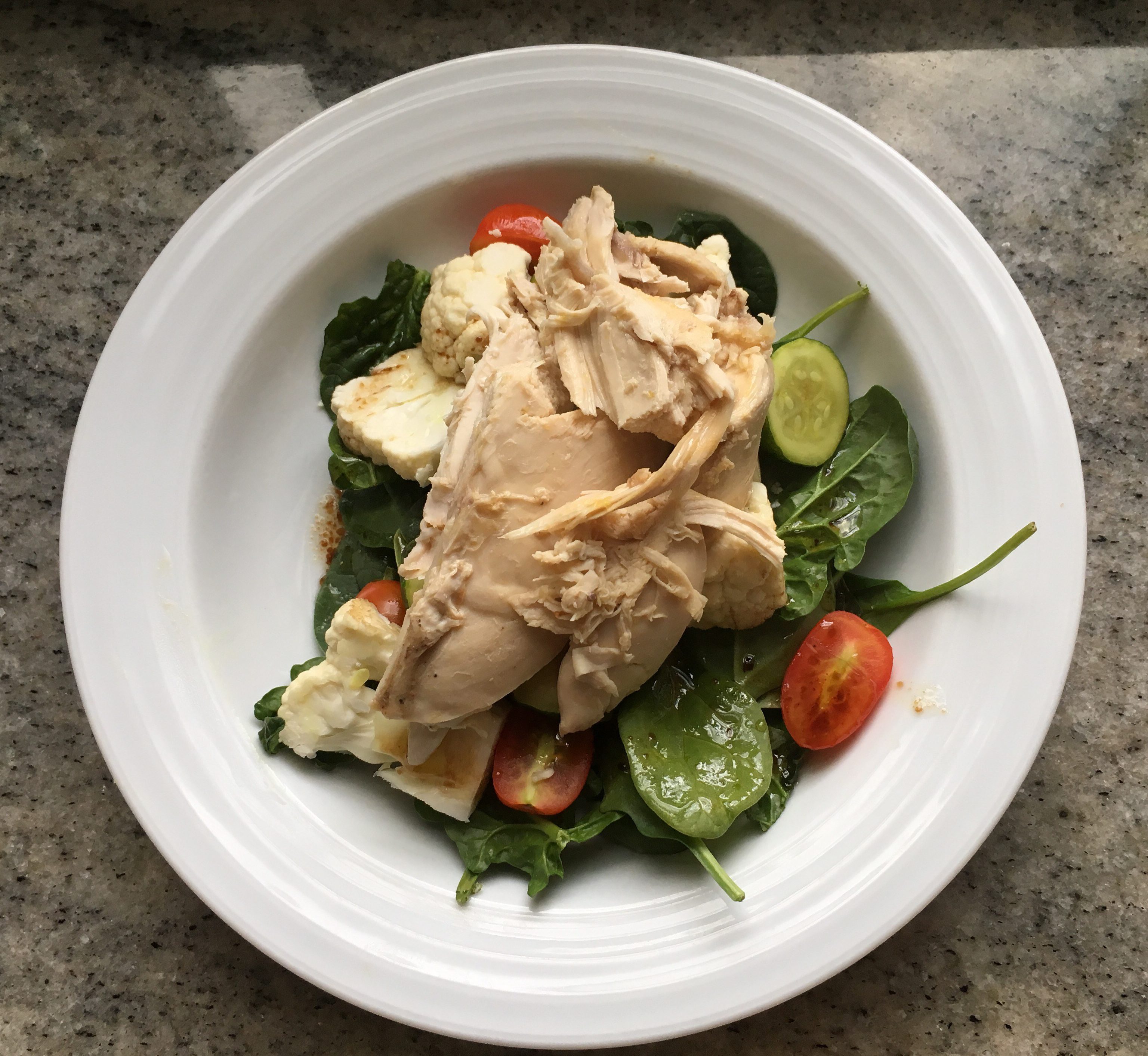 Warm chicken salad with steamed zucchini, cauliflower & grape tomatoes.