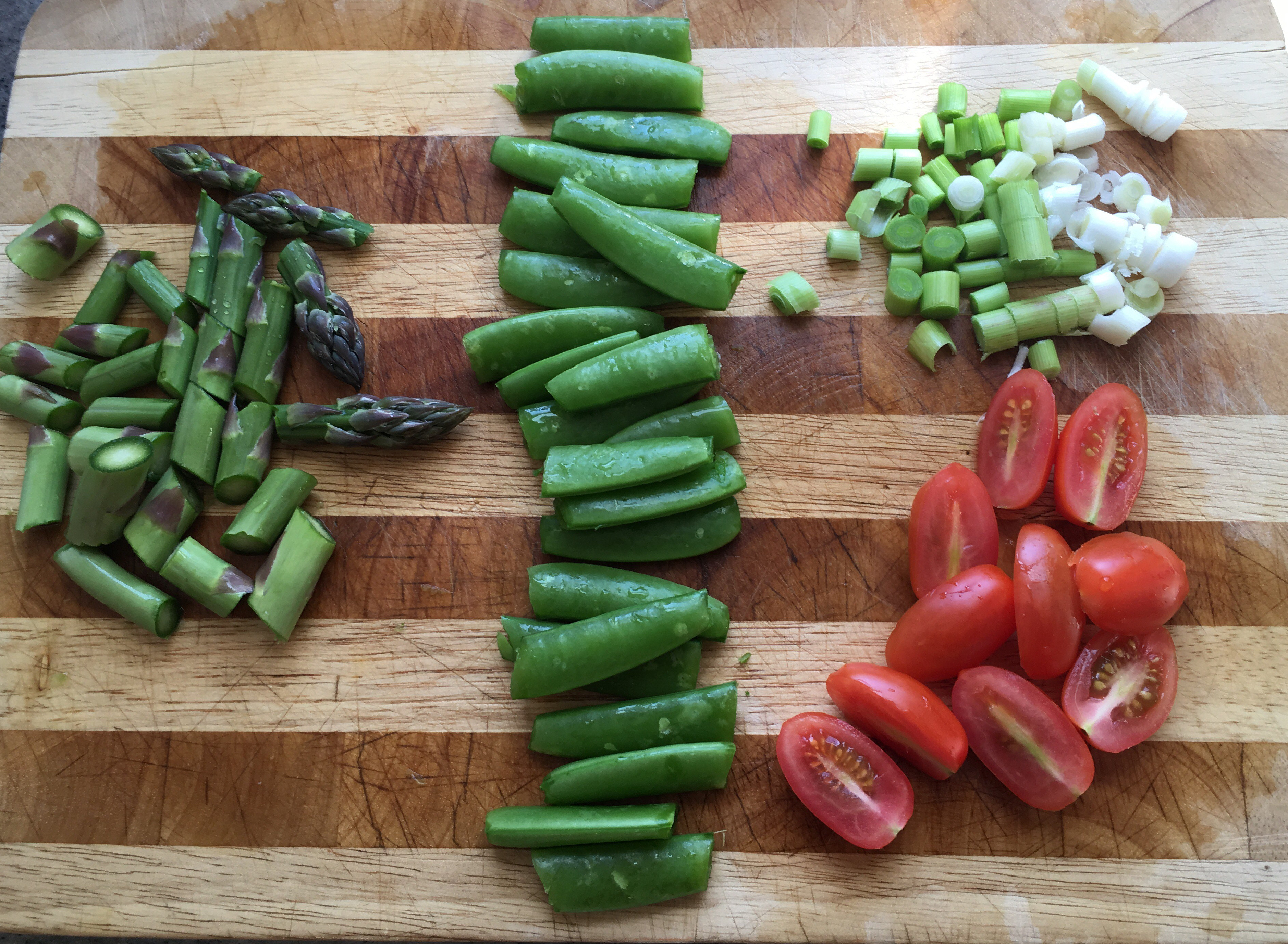 Asparagus, sugar snap peas, green garlic & grape tomatoes.