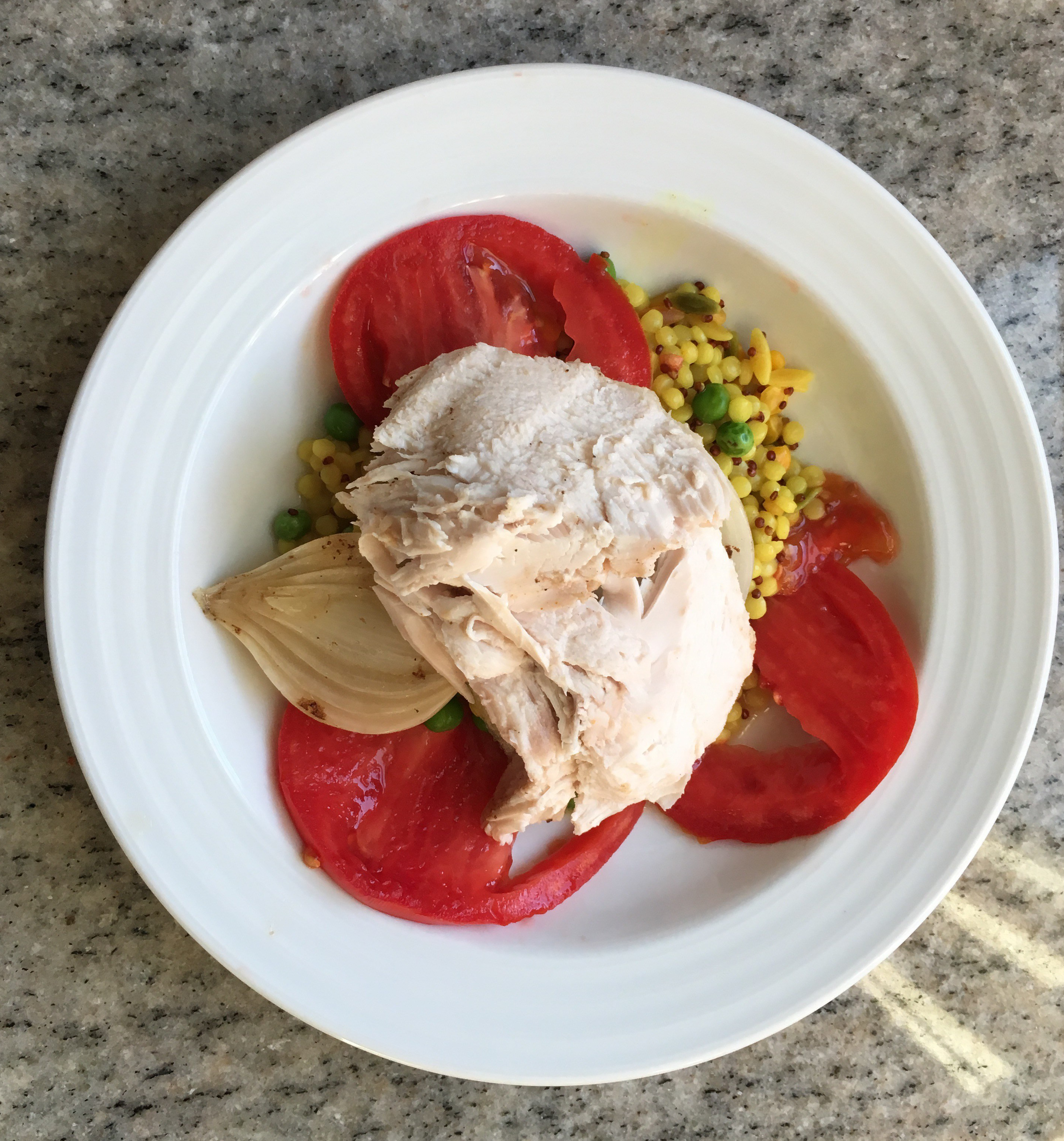 BBQ mustard slow cooker chicken over tomato, onion, cous cous & pea salad